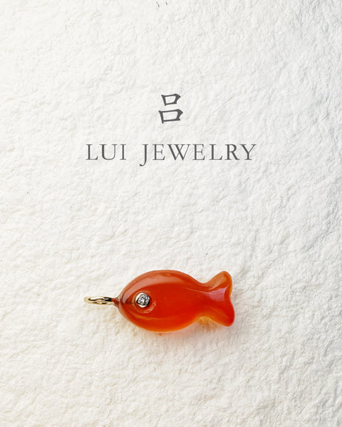 Hand-carved carnelian goldfish charm with 14k yellow gold bail by Lui Jewelry